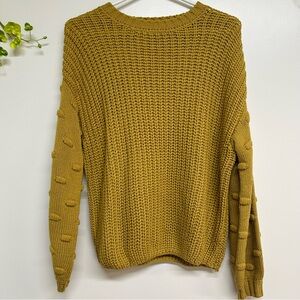 Women's size small golden yellow long sleeve sweater with bubble details
